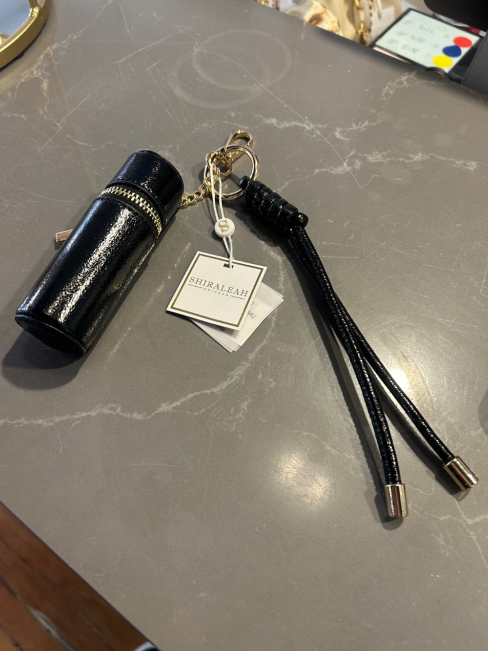 Shiraleah Black Patent Lipstick Case Keychain with Gold Hardware - Picture 7 of 11